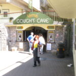 Entrance to Gough's Cave with visitors outside.